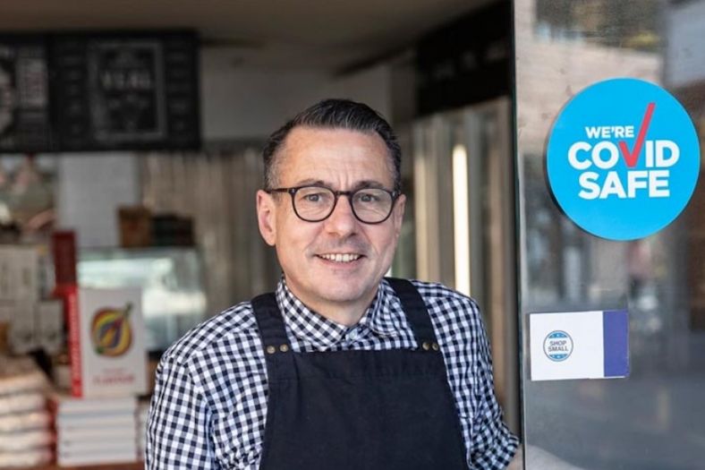 Butcher with COVID Safe sign on door