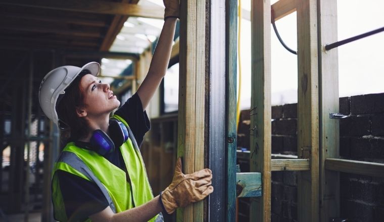 A woman construction worker on a building site.