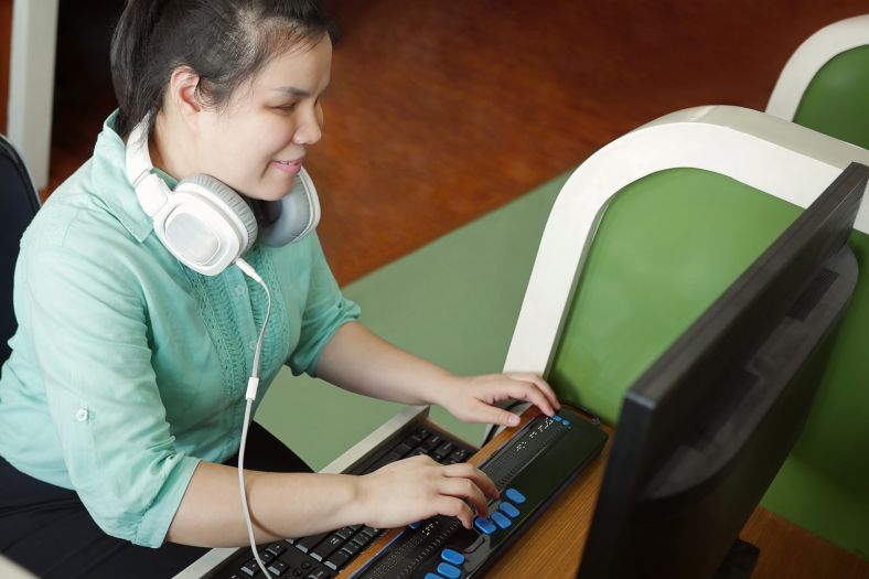 Blind person using a braille keyboard