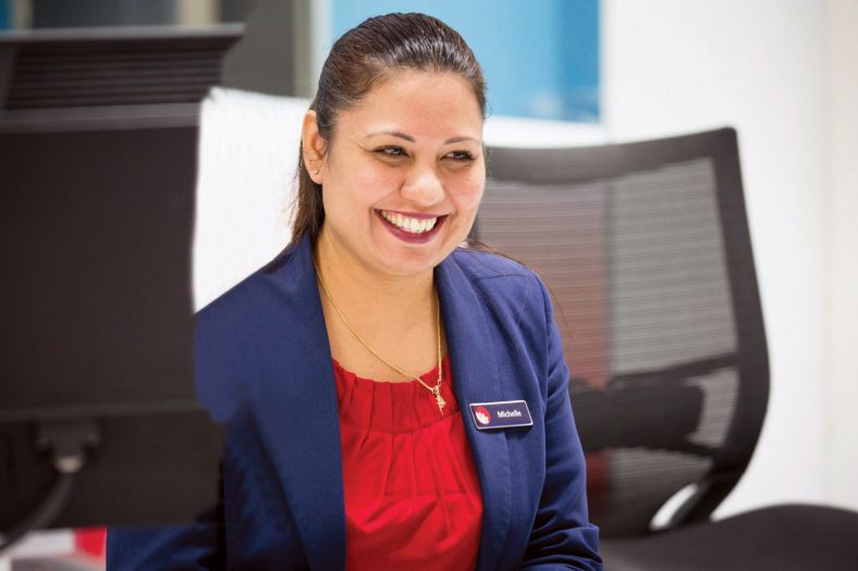 Michelle from Service NSW smiling at a service centre