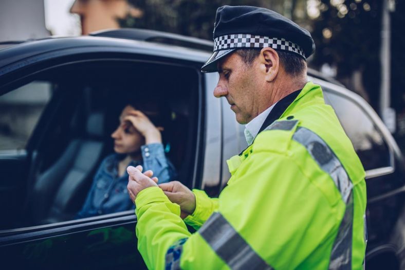 Police officer giving a driving fine