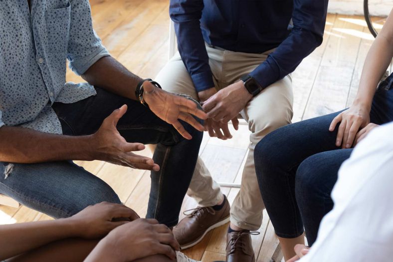 A circle of people having a discussion