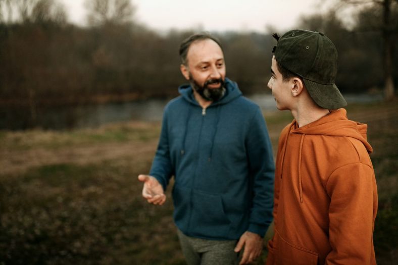 A father talking to a teenager