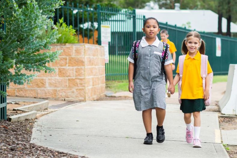 School girls walking outside a NSW public school