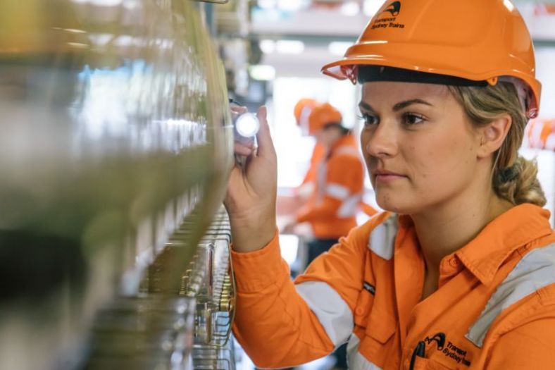 A female technician hard at work in high viz