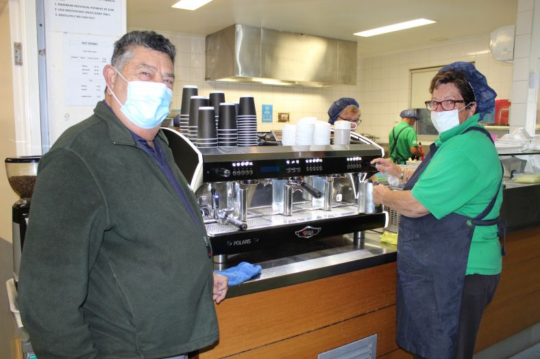 BH Contribution Fund President John Bacich checking out the new coffee machine with Kiosk volunteer Cheryl Meuret