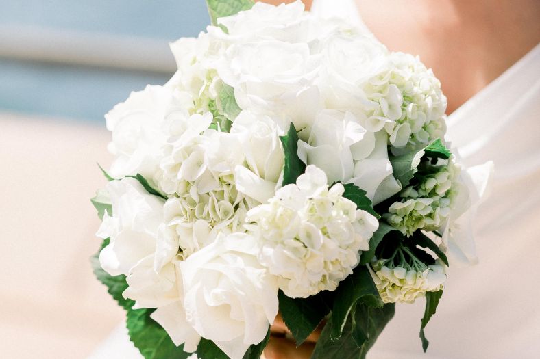 White and green coloured floral bouquet.