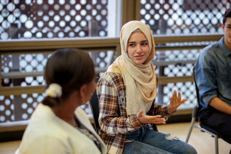 Woman talking in group therapy session