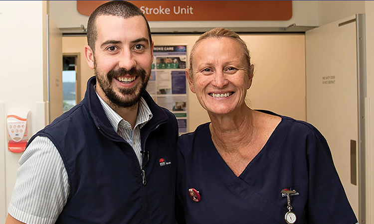 Two smiling nurses looking at camera
