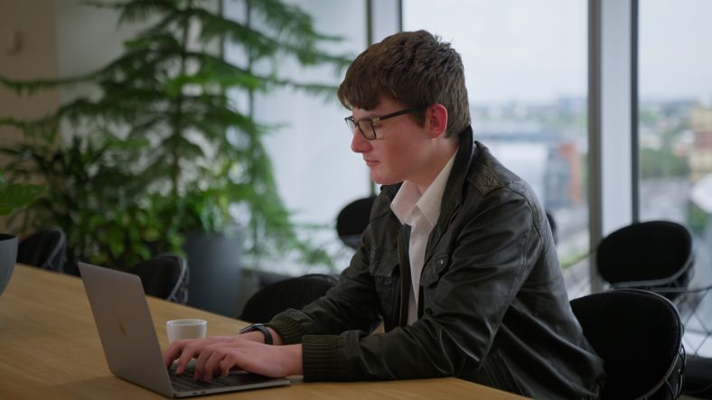 Male student on laptop