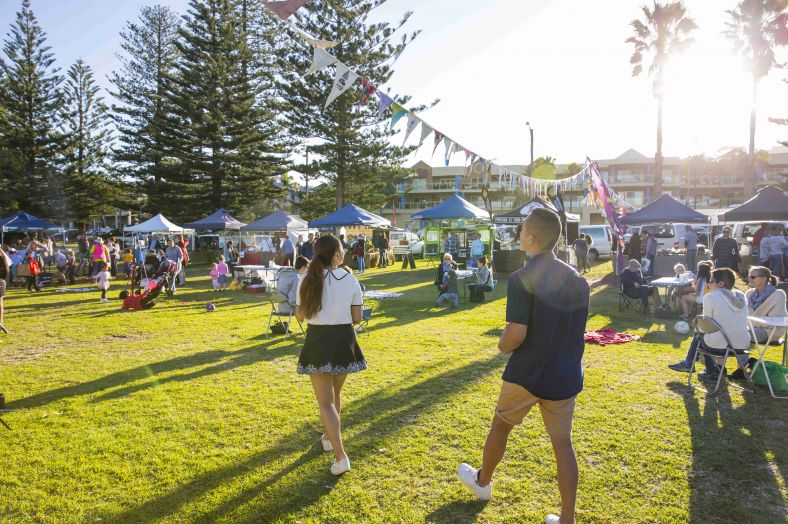 People walking at Kiama market