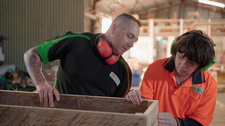 Training instructor and student in workshop