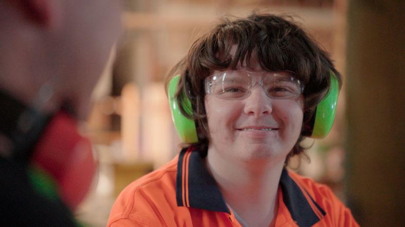 Smiling student in woodworking class