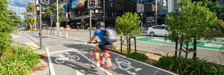 Man cycling through inner city