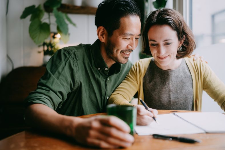 Young couple planning and designing new home