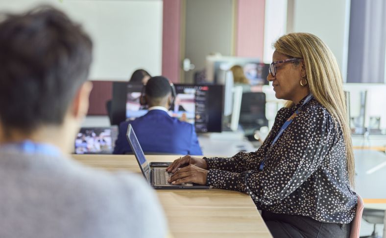 Co-workers working in open space office 