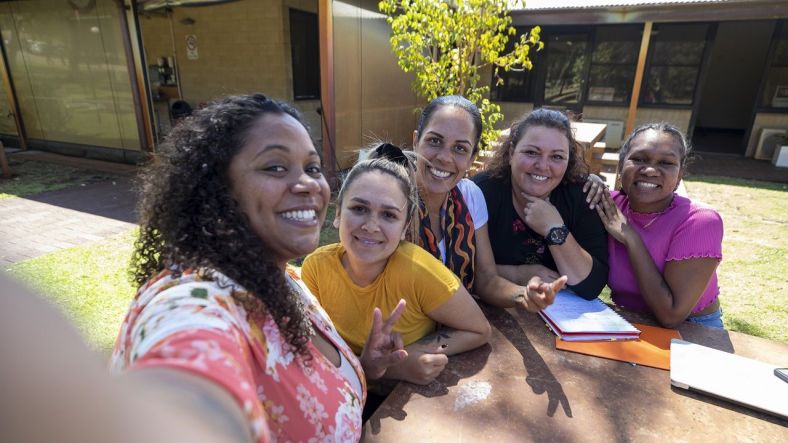 Diverse group of women looking into camera