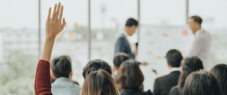 Woman holding up hand in presentation