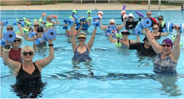 Image of people in a swimming pool holding colourful foam dumbbells for an aqua fitness class in Lockhart.