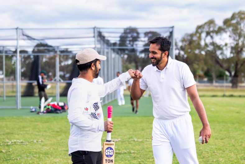 A man giving a fist bump to a friend