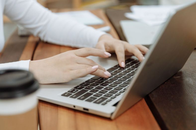 Hands on a laptop