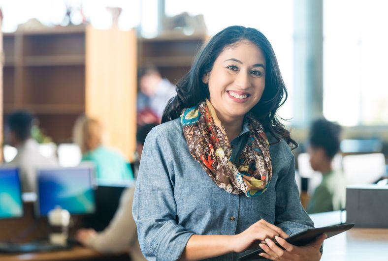 Woman leaves library with laptop