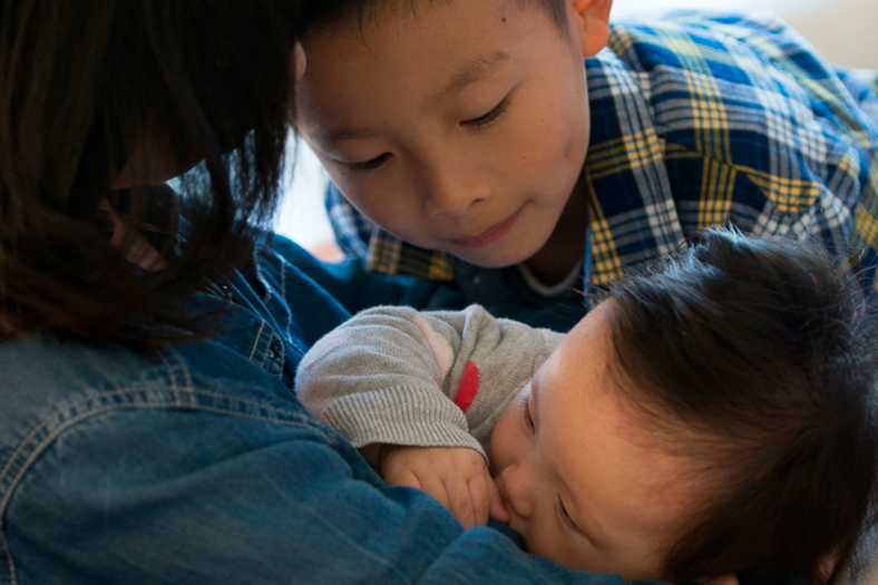 Woman breastfeeding child