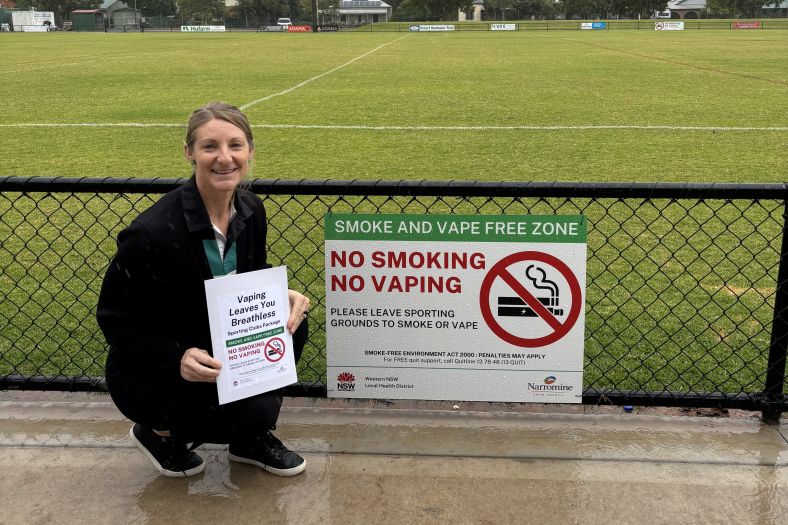 Health Promotion officer Emma Fitzgerald shows off anti-smoking signage