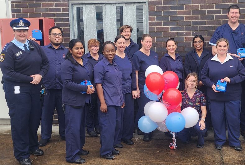 nurses standing and smiling