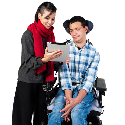 A family or friend is helping a person with a disability complete their application on a tablet.