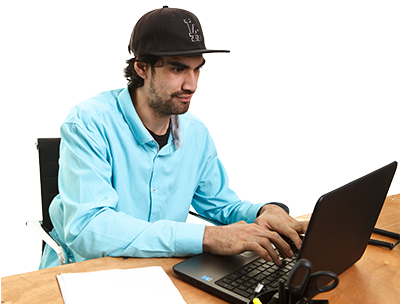 A man at a desk using a laptop