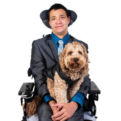 A man in a wheelchair with his support animal.