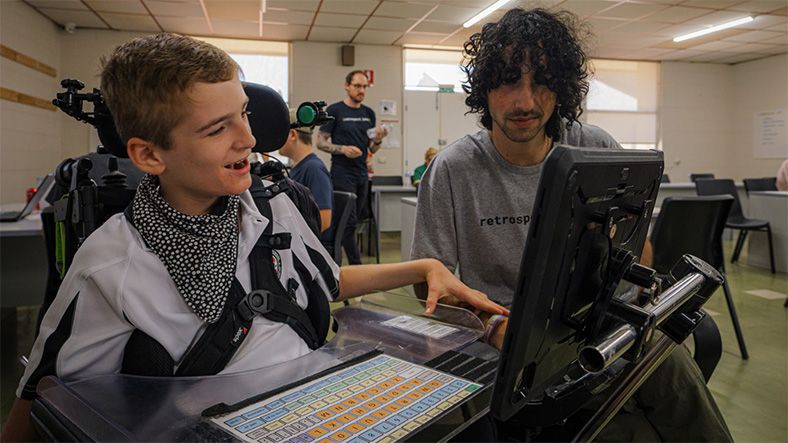 Teacher with Far West student on laptop