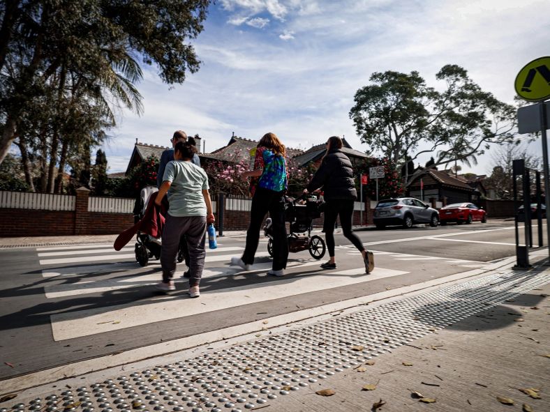 Parents using raised crossing