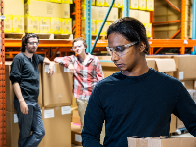 Person in warehouse being treated differently