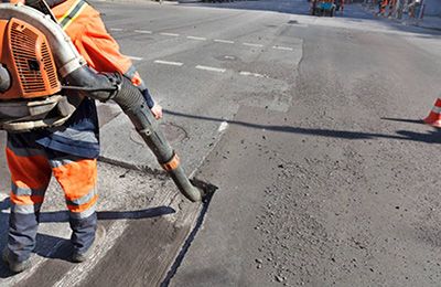 Worker carrying equipment.