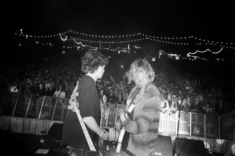 A black and white image of Royel Otis performs on stage