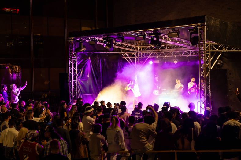 Artist performing in front of a crowd at Parramatta Lanes