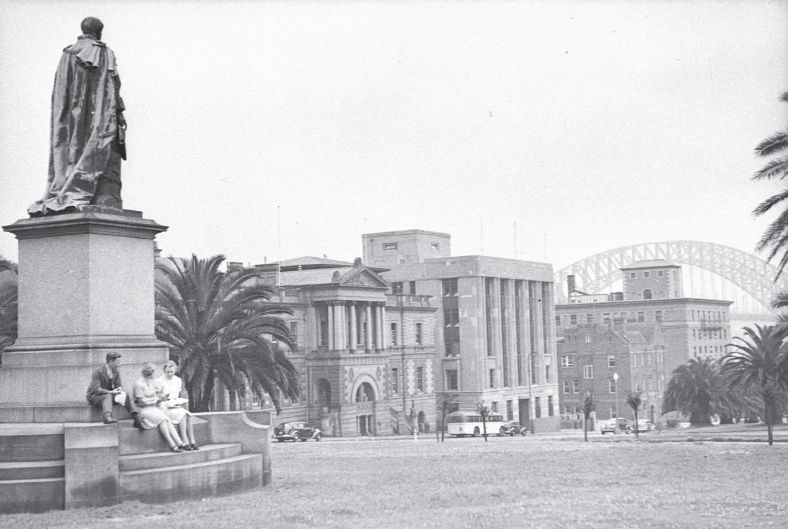 The Treasury Building from the Royal Botanic Gardens with the newly constructed Sydney Harbour Bridge in the background, 1938.