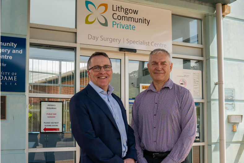 Two men standing in front of Lithgow private Hospital entrance