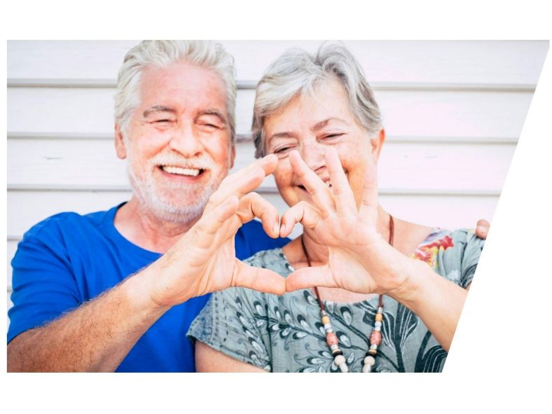 Seniors making heart with hands