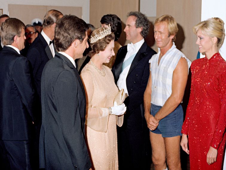 Photo of the entertainers lining up to meet the Queen and the Duke of Edinburgh after a performance at the Sydney Opera House. 