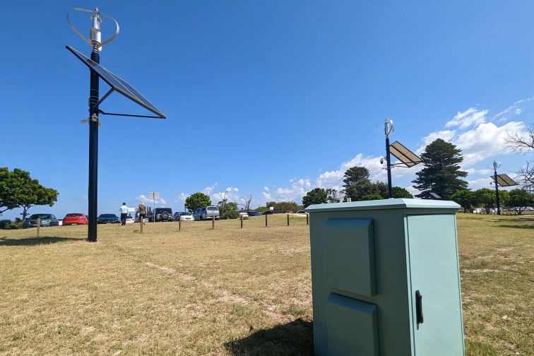 Carbon fibre poles with CCTV, solar panels and wind turbines installed, with a storage unit for computers, memory and batteries. Credit: Bayside Council