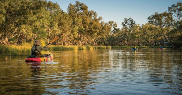 river with red kayak