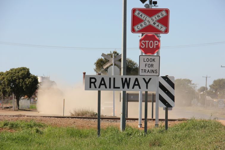 Augmented stop sign in dust, Dandaloo Road eastbound Narromine