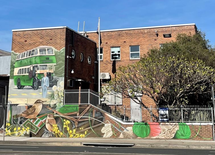 Mural on a bus depot brick wall, Burwood