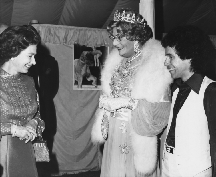  Queen Elizabeth II, Dame Edna Everage (Barry Humphries) and Leo Sayer attend the Royal Windsor Big Top Show.