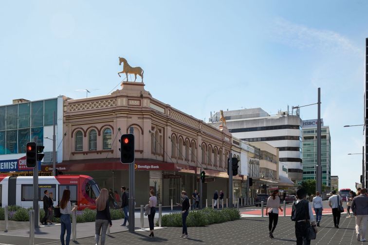 An artist's impression of a light rail approaching a street corner.