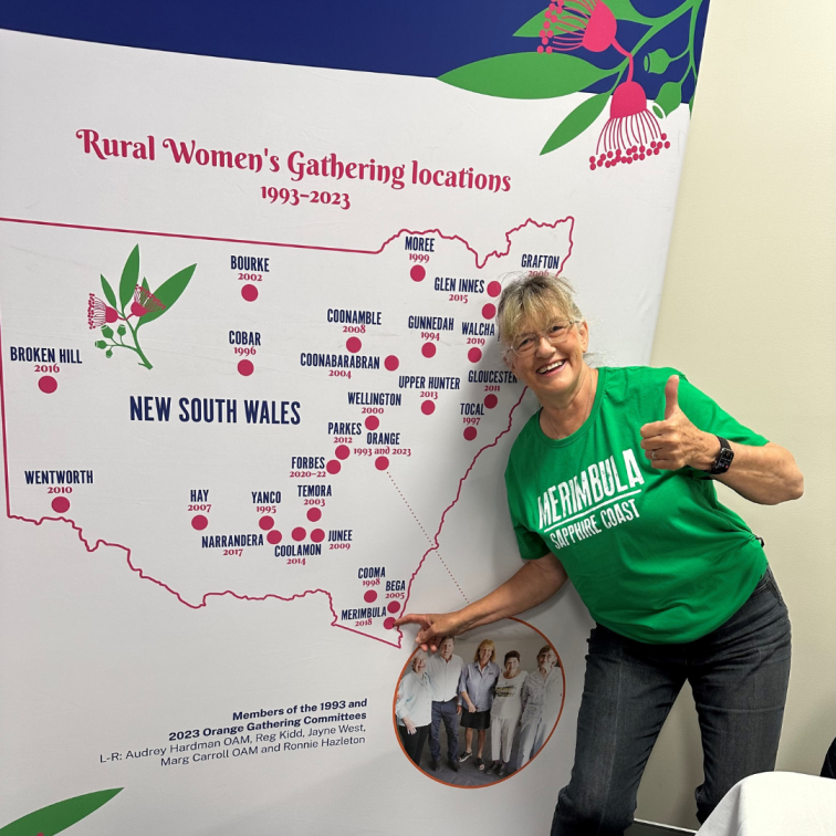In front of RWG locations map at 2023 Gathering in Orange