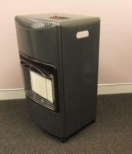 A gas heater by a wall